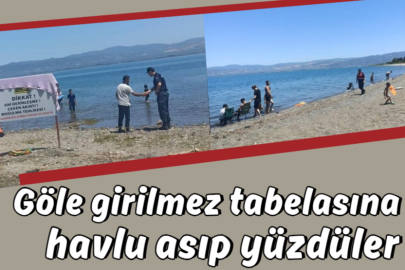 Göle girilmez tabelasına havlu asıp yüzdüler