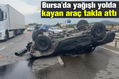 Bursa'da yağışlı yolda kayan araç takla attı