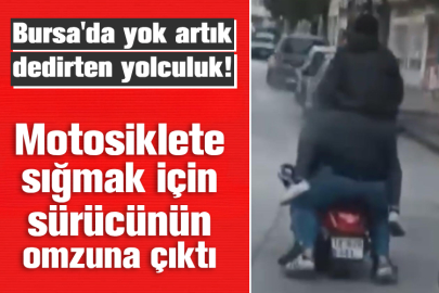 Bursa'da motosiklete sığmak için sürücünün omzuna çıktı