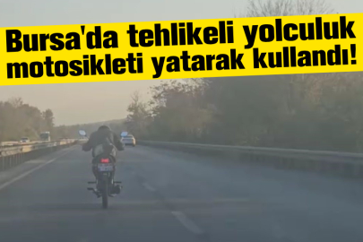 Bursa'da tehlikeli yolculuk motosikleti yatarak kullandı!