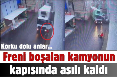 Freni boşalan kamyonun kapısında asılı kaldı